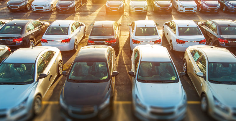 A parking lot filled with cars