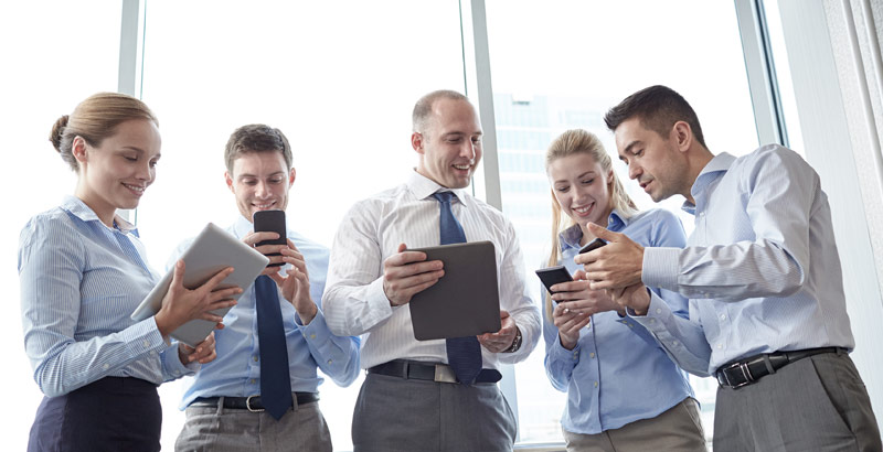 A group of professionals discussing their corporate insurance needs.