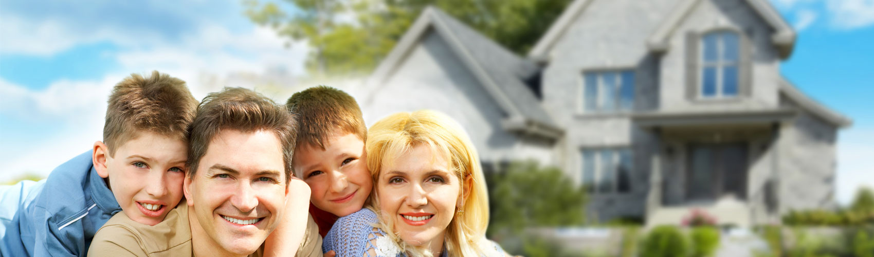 A happy family in front of their house